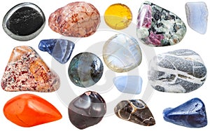 Many tumbled ornamental gem stones isolated