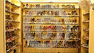 Many types of leather shoes at shoes shop. Exquisite wedding shoes in the store window