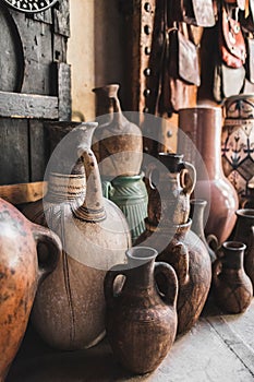 Many unique handmade clay jugs and vases on local arab market. Souk in Marrakesh