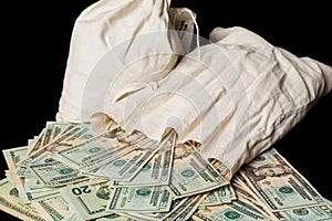 Many US dollar bills or notes with money bags