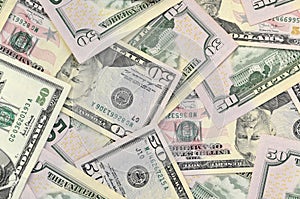 Many US fifty dollar bills on flat background surface close up. Flat lay top view. Abstract business concept