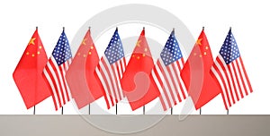 Many USA and China flags on white background. International relations