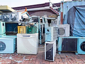 Many used air conditioners and fridges on street