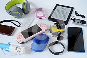 Many used modern Electronic gadgets for daily use on White floor, Reuse and Recycle concept