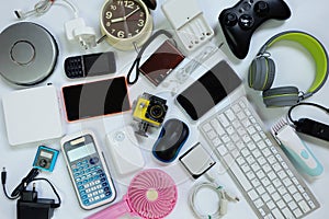 Many used modern Electronic gadgets for daily use on White floor, Reuse and Recycle concept photo