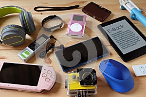 Many used modern Electronic gadgets for daily use on wooden floor, Reuse and Recycle concept