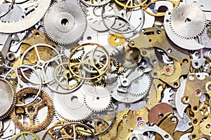 Many used watch spare parts close up