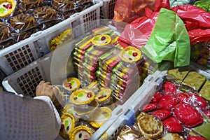 Many varieties of traditional snacks sold in the Marketplace in dawn time in Surabaya, East Java, Indonesia.