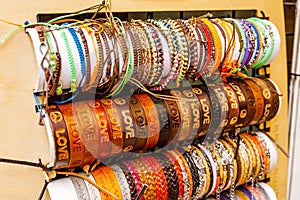 various hippie leather and textile bracelets photo