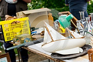 Many various items being sold on outdoor flee market.