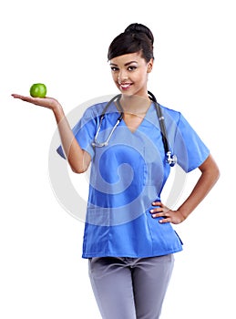 So many vitamins packed in a little snack. Studio shot of a young medical professional holding an apple isolated on
