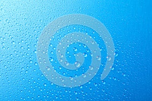 Many water drops on blue background