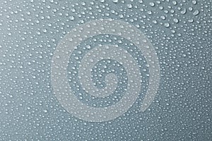 Many water drops on grey background