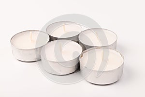 Many wax candles together on the white background