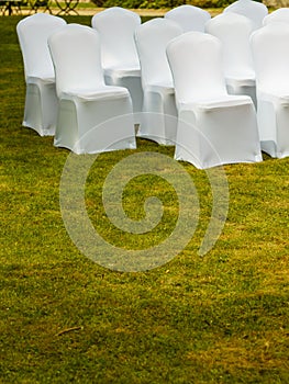 Many wedding chairs with white elegant covers