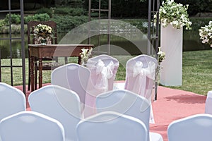 Many wedding chairs with white elegant covers