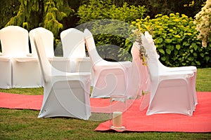 Many wedding chairs with white elegant covers