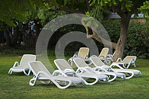 Many white deck chairs