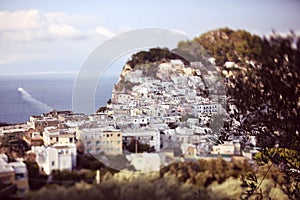 Many white houses on a cliff