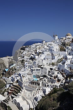 Many white houses in a cliff in Oia, Santorini, Greek Islands