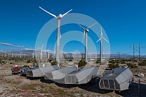 Many wind machines in the desert with blue sky