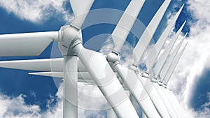 Many wind power generators on sky background.