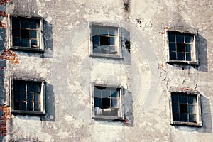 Many windows on the facade of the old building. Monotone architecture