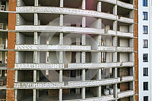 Many windows on new apartment building facade under construction