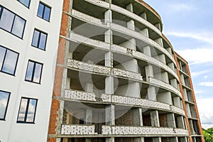 Many windows on new apartment building facade under construction