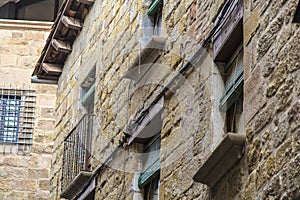 Many windows on a rock wall