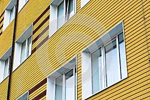 Many windows in yellow building