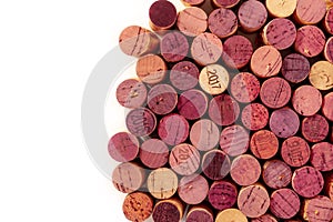 Many wine corks, shot from the top on a white background with copy space