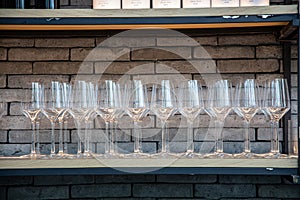 Many wine glasses arranged in a row