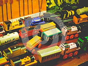 Many wood train toy on the shelf