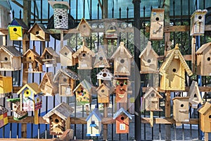 Many wooden birdhouses are presented at the exhibition. They are made by children with the help of adults, handmade