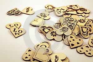 Many wooden hearts on white background