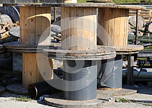 Many wooden reels for electrical cables in landfill