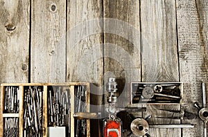 Many working tools on a wooden background