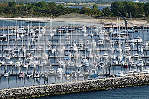 Many yachts and sailboats in marina. Vacation, cruising and travel concept