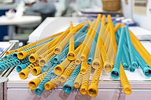 Many Yellow and blue metal coil spring equipment part of appliance machine in manufacturing process or automotive or different