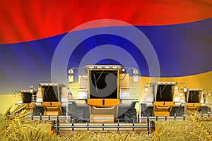 many yellow farming combine harvesters on wheat field with Armenia flag background - front view, stop starving concept -