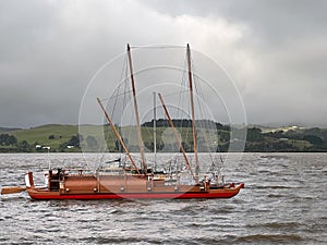 Maori Double hulled sailing waka mooring in Northland New Zealand