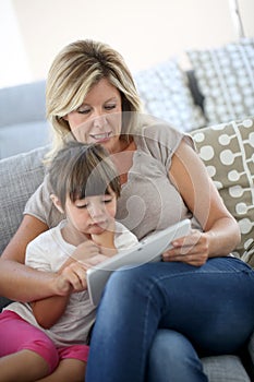 Maother and daughter using tablet