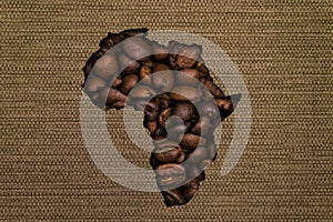 Map of Africa made up of coffee beans on a background of canvas fabric
