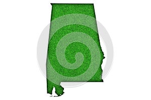 Map of Alabama on green felt