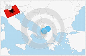 Map of Albania with a pinned blue pin. Pinned flag of Albania