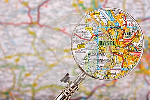 Map of Basel with magnifying glass on table