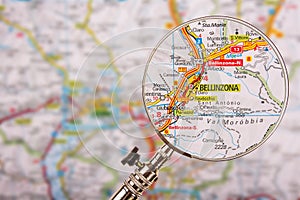 Map of Bellinzona with magnifying glass on table