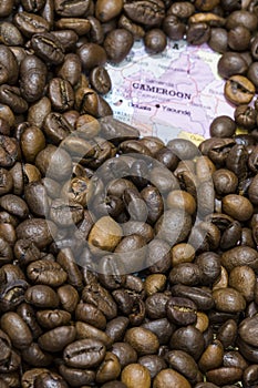 Map of Cameroon under a background of coffee beans