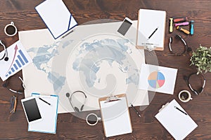 Map and clipboards on table photo